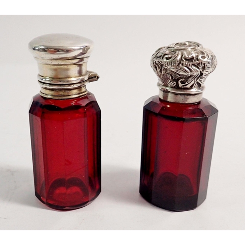 280 - Two Victorian ruby glass faceted scent bottles with white metal lids, tallest 6.5cm