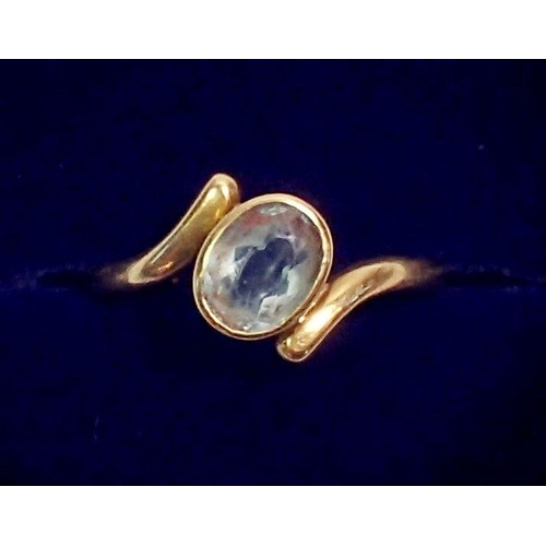 290 - An 18 carat gold aquamarine crossover ring, size L, 2.5g