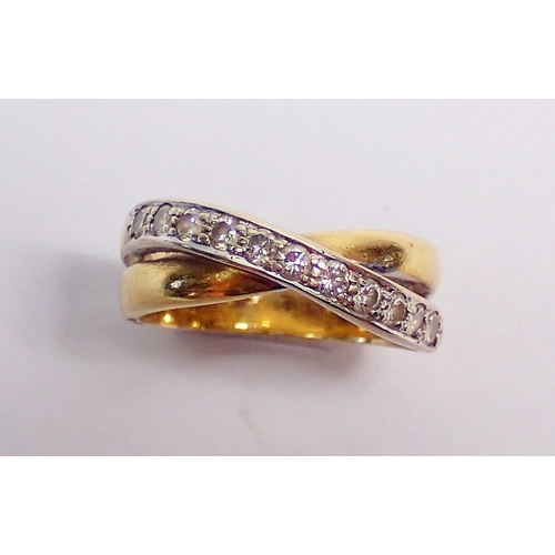 291 - An 18 carat gold diamond set twin crossover ring, size K-l, 5g