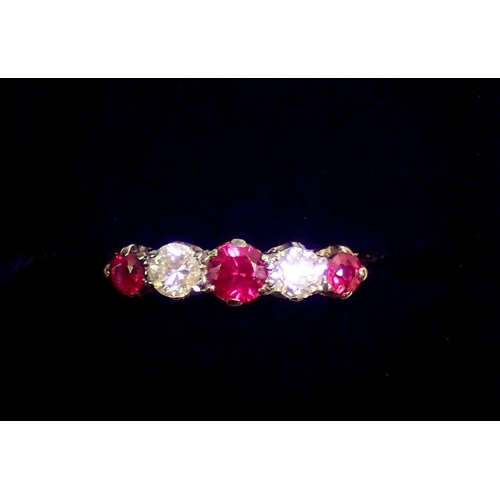 292 - An 18 carat white gold ring set three rubies and two diamonds, size O, 2.8g