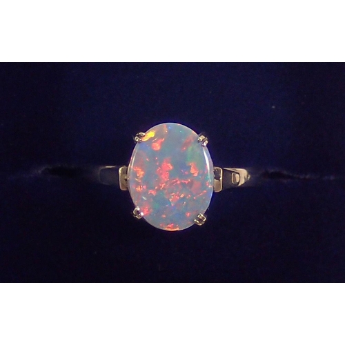 294 - A 9 carat gold oval opal ring, size N, 2.3g