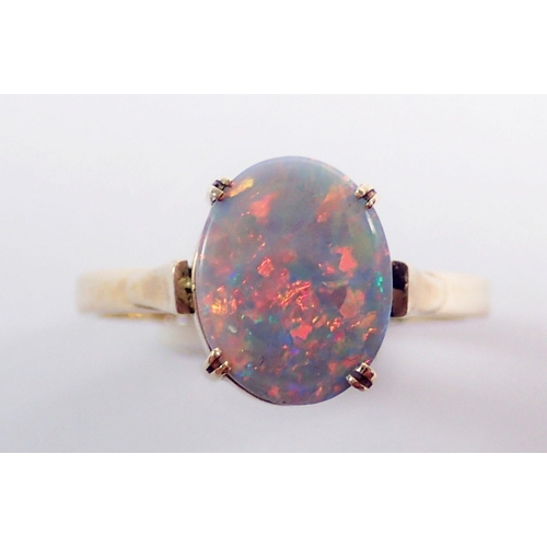 294 - A 9 carat gold oval opal ring, size N, 2.3g