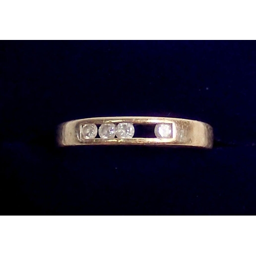 295 - An 18 carat gold ring channel set diamonds, one missing, size N-O, 3.6g