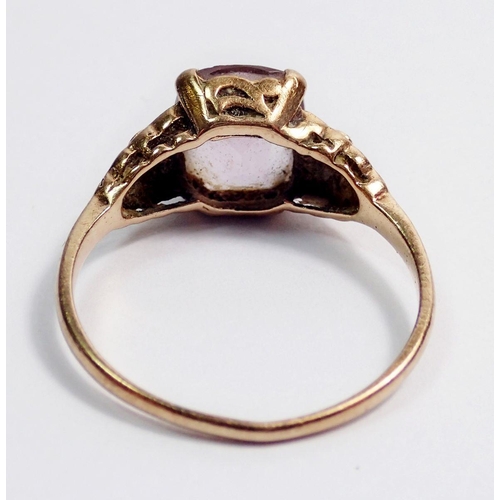 296 - A 9 carat gold amethyst ring with floral shoulders, size P, 2.2g