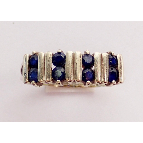 305 - A 9 carat gold ring set five pairs of sapphires, size N, 2.8g