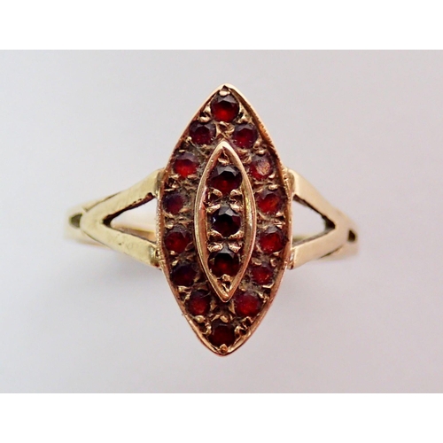 310 - A 9 carat gold marquise form garnet ring, size N, 3.2g