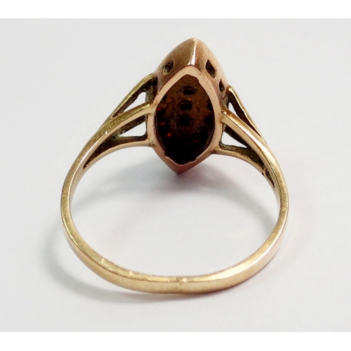 310 - A 9 carat gold marquise form garnet ring, size N, 3.2g