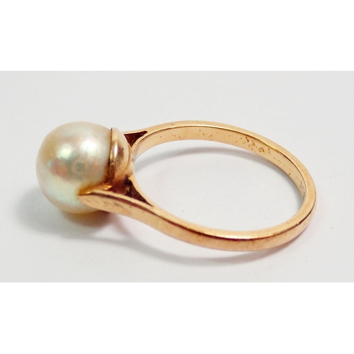 312 - A French 18 carat gold ring set pearl, size K, 3g, with eagle head mark