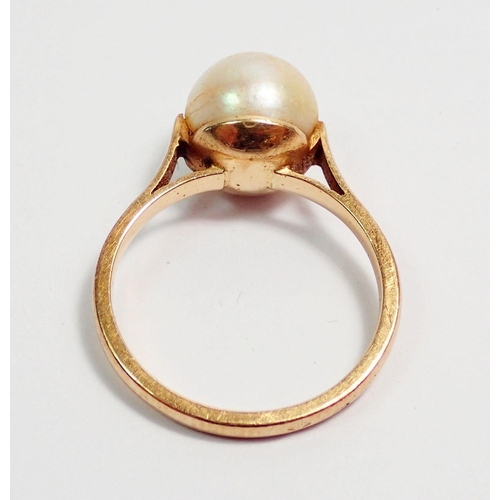 312 - A French 18 carat gold ring set pearl, size K, 3g, with eagle head mark