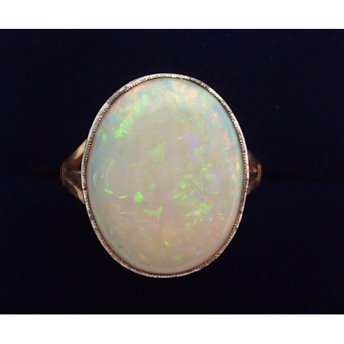 314 - A 15ct gold ring set large oval cut opal, size N to O, 6.8g, 2cm x 1.7cm