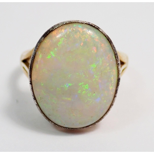 314 - A 15ct gold ring set large oval cut opal, size N to O, 6.8g, 2cm x 1.7cm