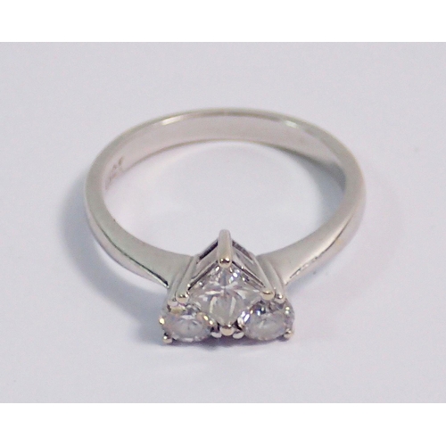 315 - An 18 carat white gold ring set two brilliant cut and one princess cut diamonds, forming a heart sha... 