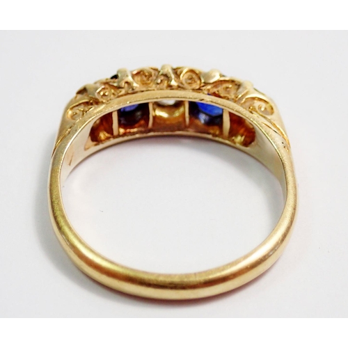 317 - An 18 carat gold ring set two sapphires and three diamonds, size N, 4.3g