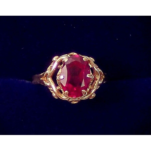 319 - A French 18 carat gold ring set oval cut synthetic ruby, size H, 3.5g