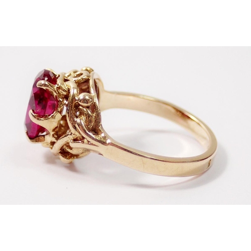 319 - A French 18 carat gold ring set oval cut synthetic ruby, size H, 3.5g