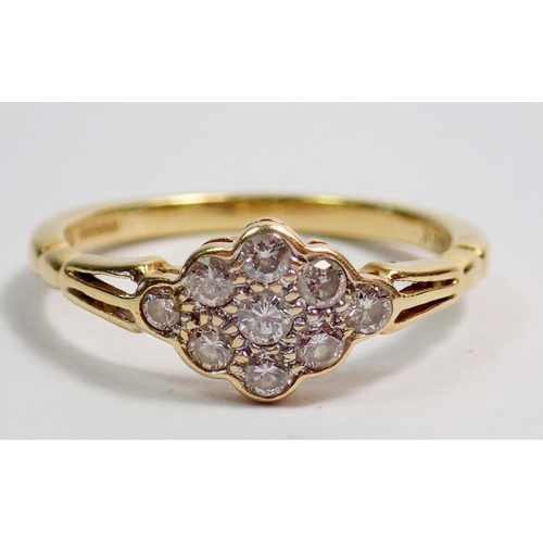 321 - An 18 carat gold ring set panel of nine diamonds, size M to N, 2.7g