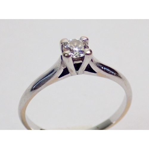 327 - A platinum set diamond solitaire ring, unmarked, size J, 2g