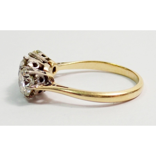 331 - An 18 carat yellow gold three stone diamond ring, size L, 3.5g, centre stone 6mm, side stones 5mm ap... 