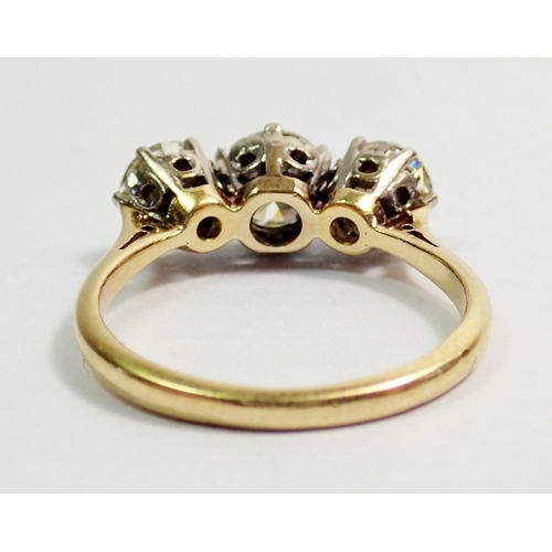 331 - An 18 carat yellow gold three stone diamond ring, size L, 3.5g, centre stone 6mm, side stones 5mm ap... 