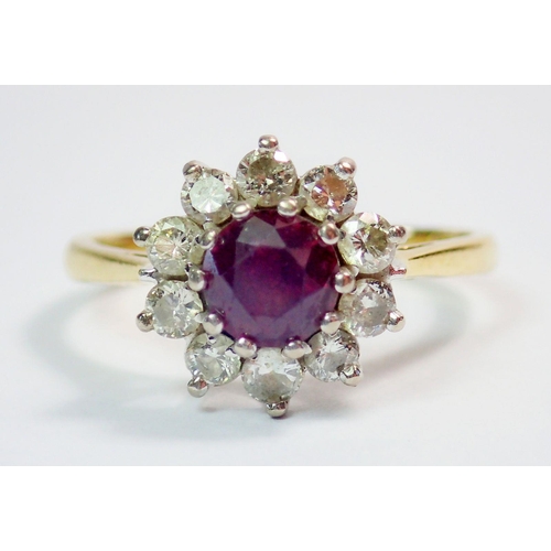 332 - An 18ct gold ruby and diamond cluster ring, size M, 3.5g