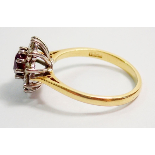 332 - An 18ct gold ruby and diamond cluster ring, size M, 3.5g