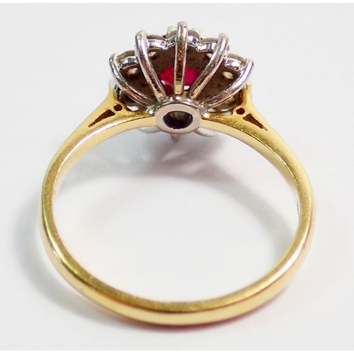 332 - An 18ct gold ruby and diamond cluster ring, size M, 3.5g