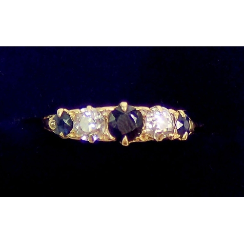 333 - An 18ct gold ring set two diamonds and three sapphires, size J, 3.2g