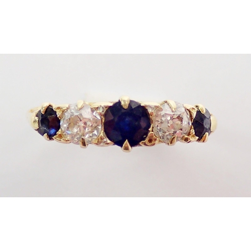 333 - An 18ct gold ring set two diamonds and three sapphires, size J, 3.2g