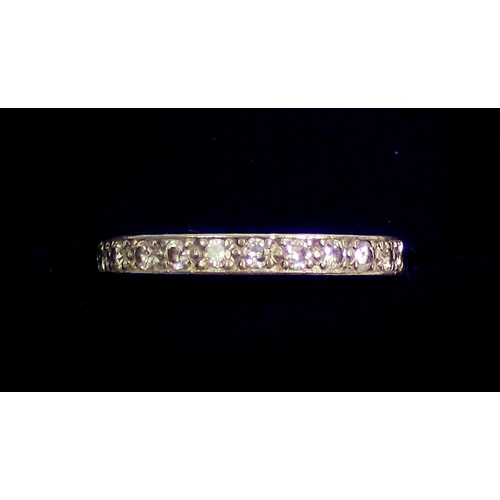 334 - A diamond set full eternity ring set in white metal, size L, 2.8g