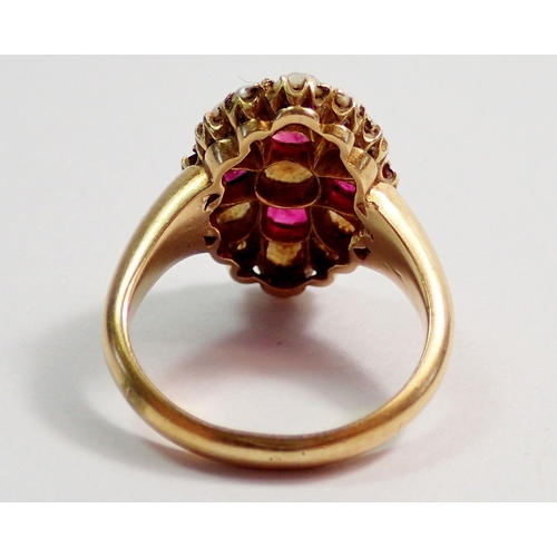 335 - A Victorian 18 carat gold ring set arrangement of four rubies and fifteen pearls, size M, 8.2g, 1.8c... 