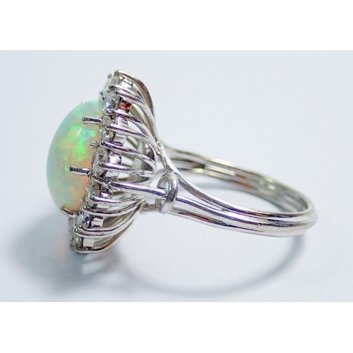 338 - An 18 carat white gold opal and diamond large cluster ring, size N, 7.1g, 2cm x 1.5cm total size