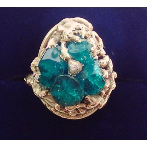 341 - A large 9ct gold ring set four rough emeralds and chip diamond, size N to O, 15g