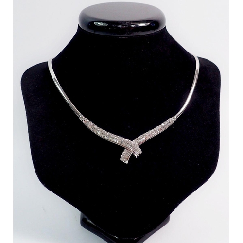 345 - A fine 18 carat white gold collar necklace with crossover front set graduated panels of baguette and... 