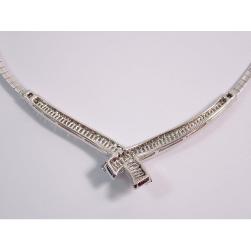 345 - A fine 18 carat white gold collar necklace with crossover front set graduated panels of baguette and... 