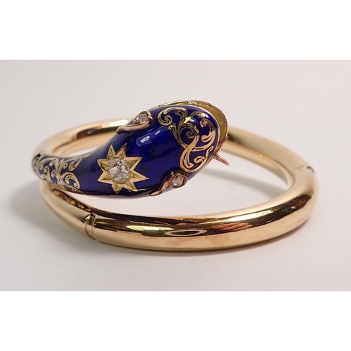 348 - An antique gold snake form bangle with blue enamel and gilt painted head inset diamonds, the open mo... 