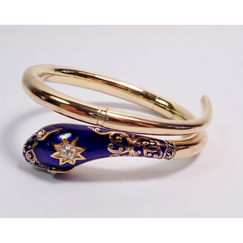 348 - An antique gold snake form bangle with blue enamel and gilt painted head inset diamonds, the open mo... 