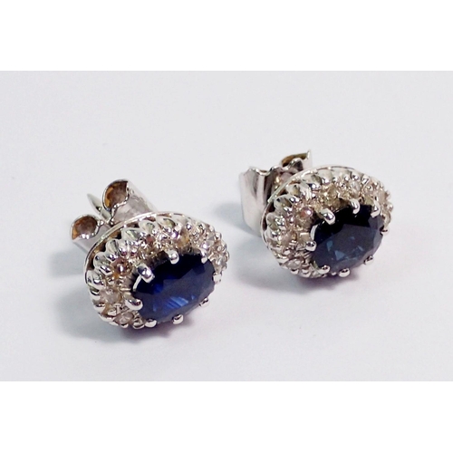 356 - A pair of white gold sapphire and diamond oval cluster earrings, 12mmx9mm, 6.2g