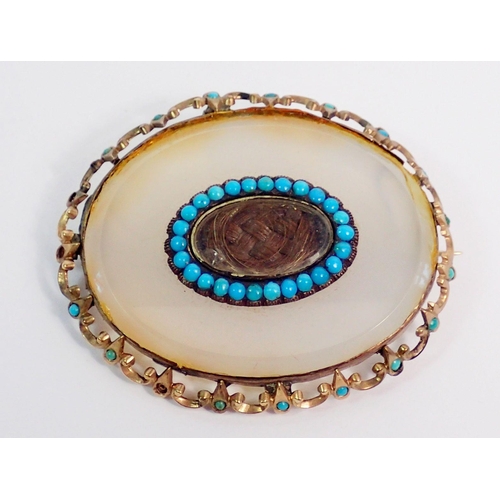 357 - A Victorian white agate mourning brooch in yellow metal and turquoise surround, inset hair panel, 4.... 