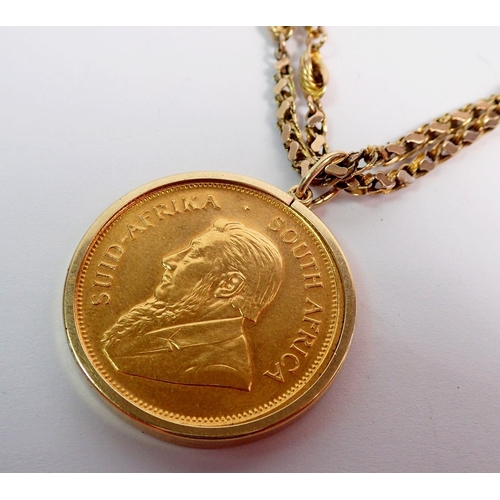 366 - A gold Krugerrand 1974, 1oz 22ct gold plus a 9ct fancy link gold chain, 9ct gold mount, total weight... 