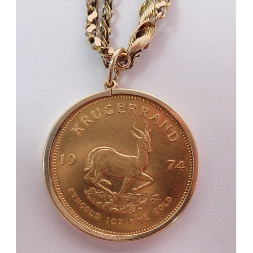 366 - A gold Krugerrand 1974, 1oz 22ct gold plus a 9ct fancy link gold chain, 9ct gold mount, total weight... 