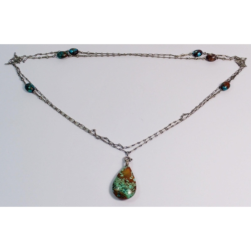 369 - An Arts & Crafts white metal turquoise matrix long pendant necklace with tear form drop and six inte... 