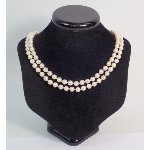 372 - A double row pearl necklace with 18 carat white gold clasp set sapphires, 43cm