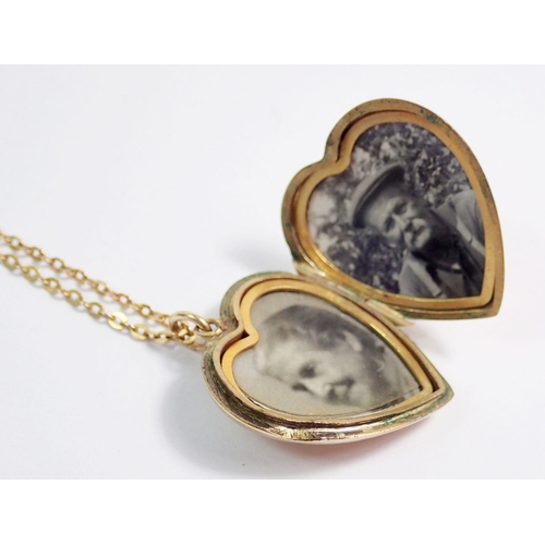 375 - A heart form 9ct gold front and back locket, 2.4cm on 9ct gold chain, total weight 5.7g