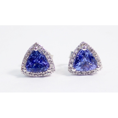 380 - A pair of 14 carat white gold trillion cut tanzanite and diamond earrings, 2.2g, 7mm across