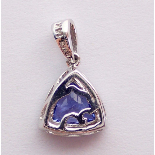 381 - A 14 carat white gold trillion cut tanzanite and diamond set pendant, 1.2g, 1cm across