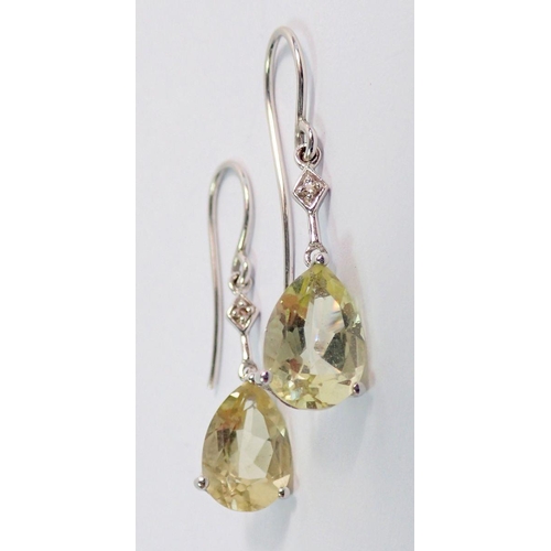 384 - A pair of 9 carat white gold earrings set citrines and chip diamonds and matching pendant necklace, ... 