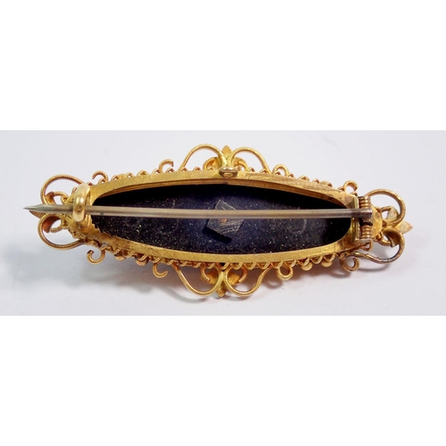 396 - A gold mourning brooch set pearls on black onyx 4.5cm wide