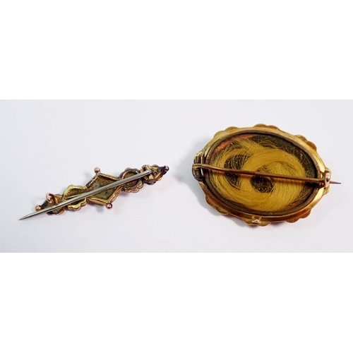 396 - A gold mourning brooch set pearls on black onyx 4.5cm wide