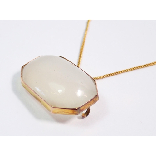 401 - A white agate 9 carat gold mounted pendant, 3cm wide on 9 carat gold chain, 42cm long - pin a/f