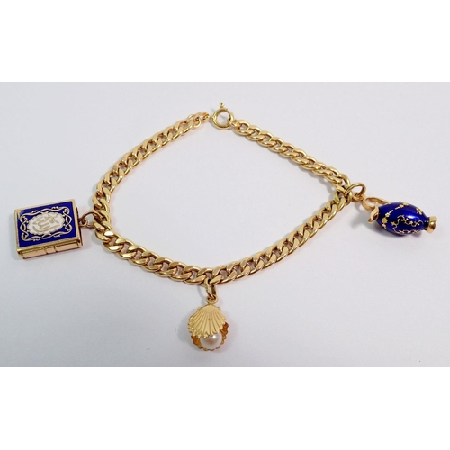 402 - An 18 carat gold charm bracelet, 11g with three 18 carat gold charms, 18cm long